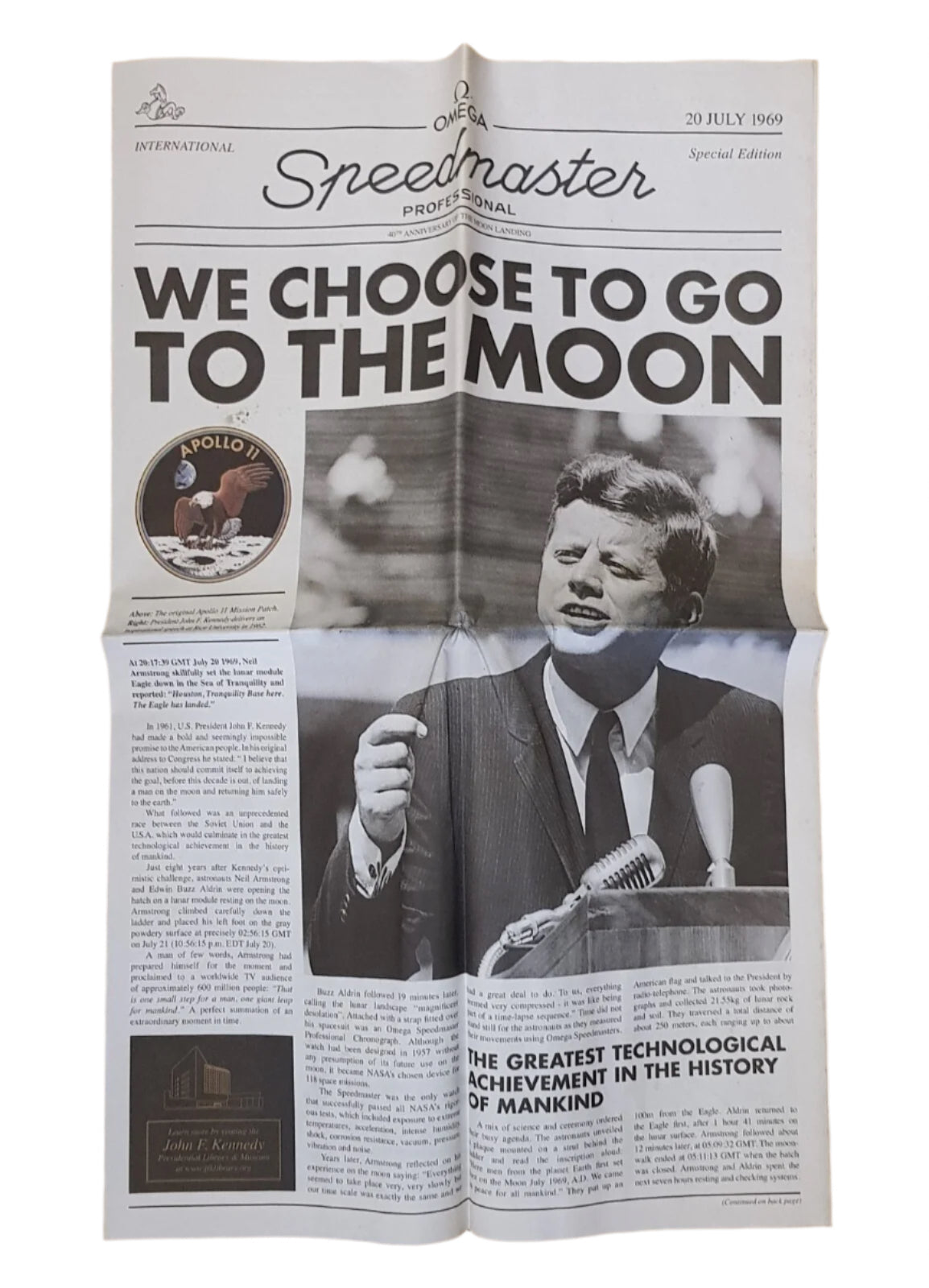 Newspaper with a headline about choosing to go to the moon, featuring a black and white photo of a JFK speaking.